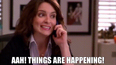 The TV character Liz Lemon from the show 30 Rock smiles anxiously and holds the phone to her ear and says, "Aah! Things are happening!"